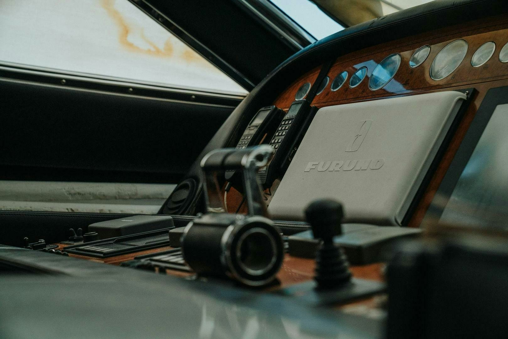 a close-up of a steering wheel aboard LOS ESQUINKLES Yacht for Sale