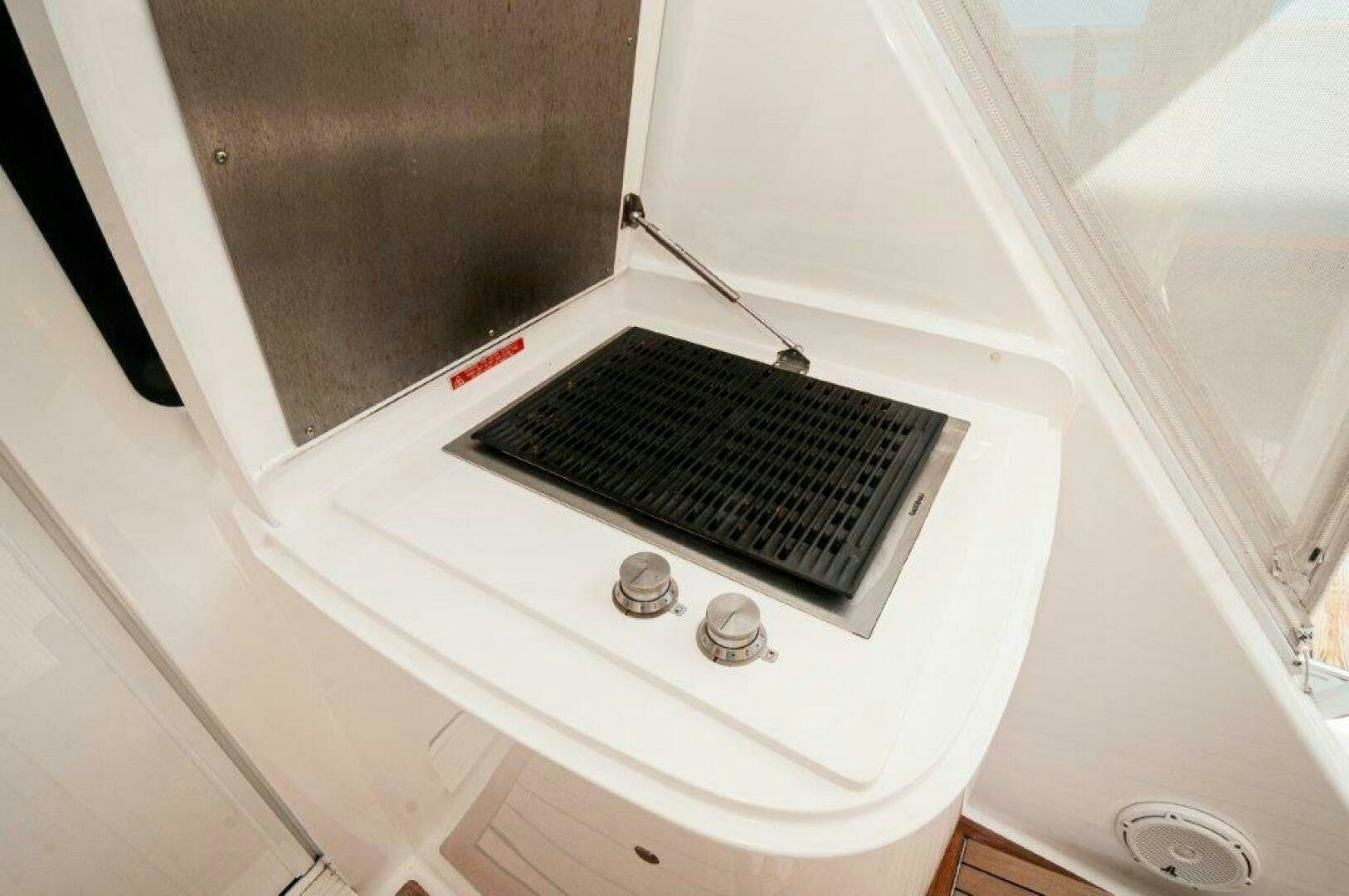 a white machine with a black screen aboard GUNNSLINGER Yacht for Sale