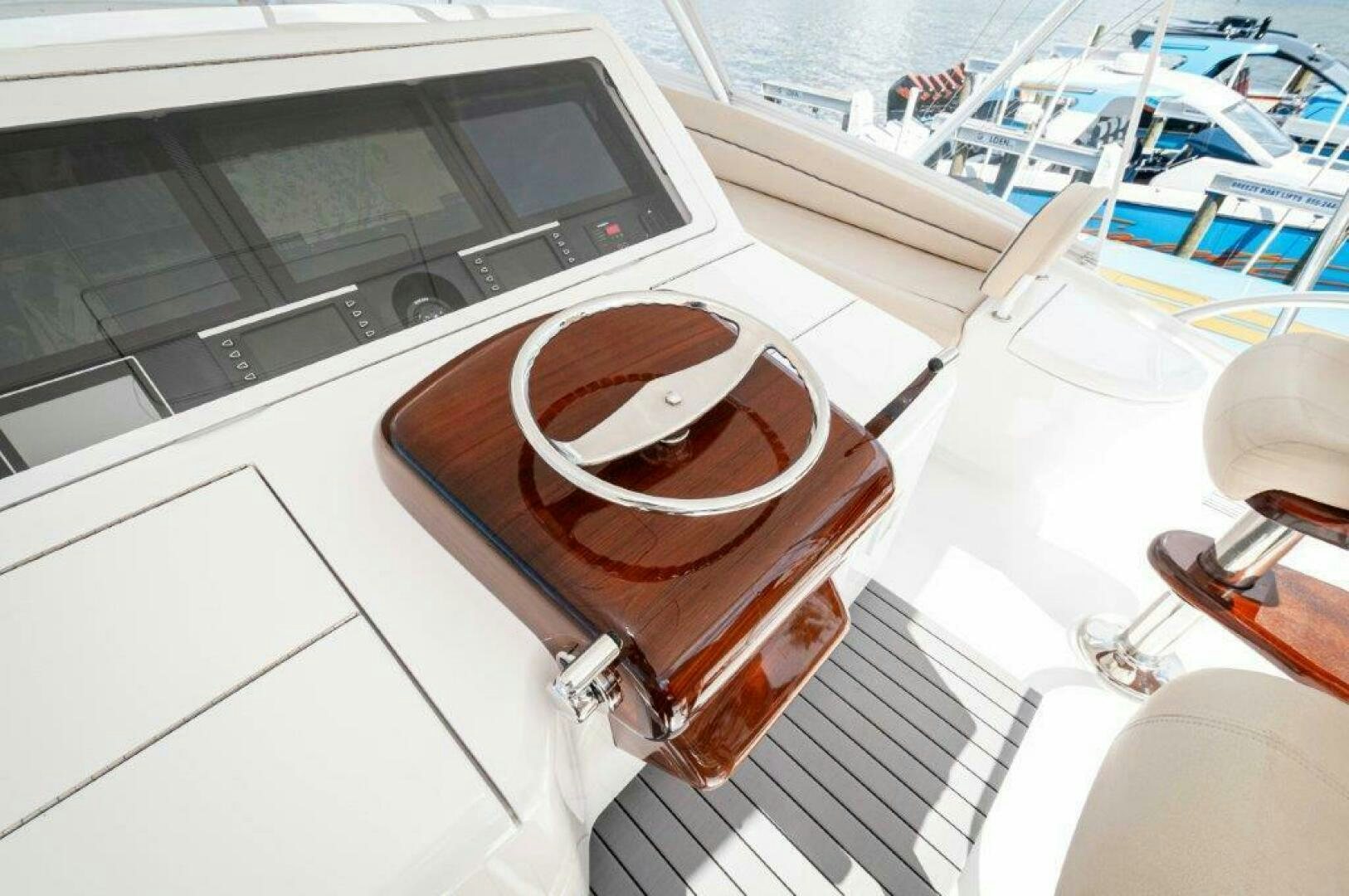 a brown leather band on a white surface next to a window aboard GUNNSLINGER Yacht for Sale