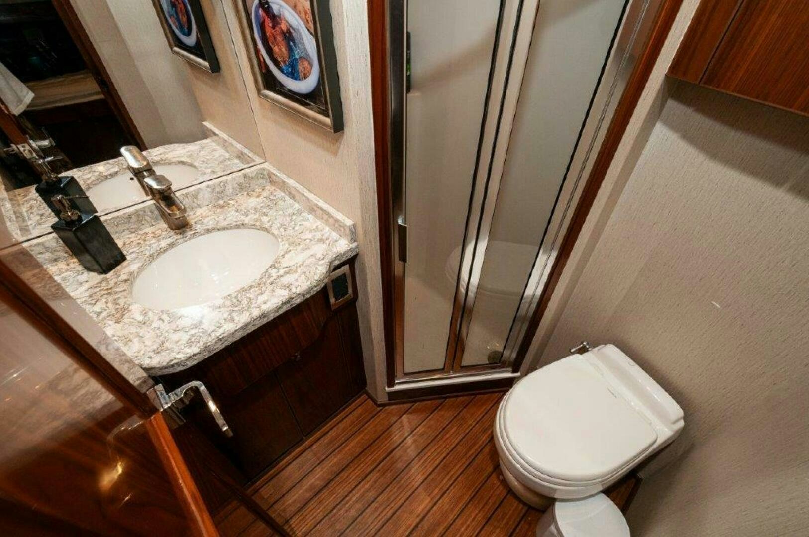 a bathroom with a sink and a toilet aboard GUNNSLINGER Yacht for Sale