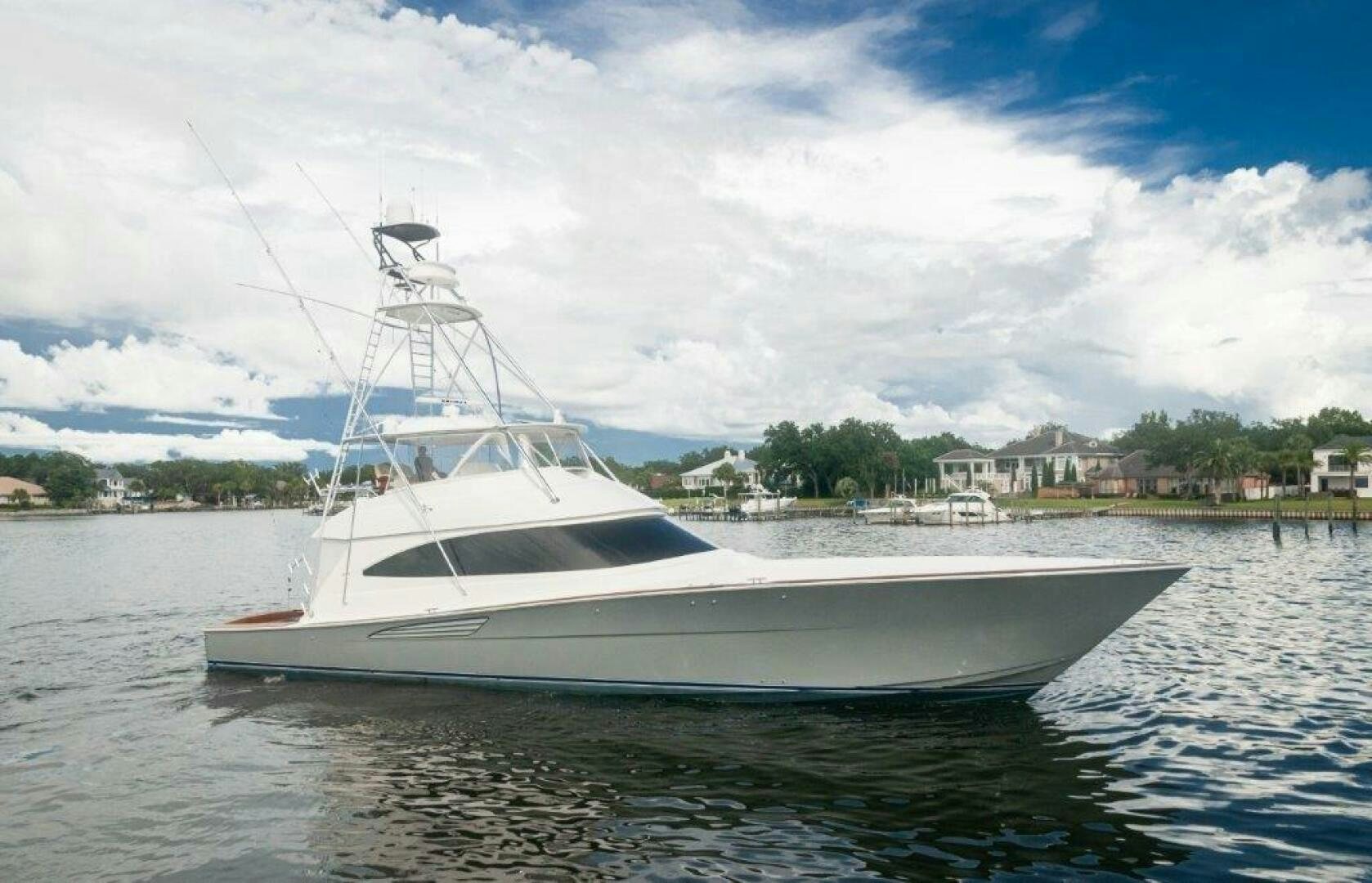 a white boat on the water aboard GUNNSLINGER Yacht for Sale
