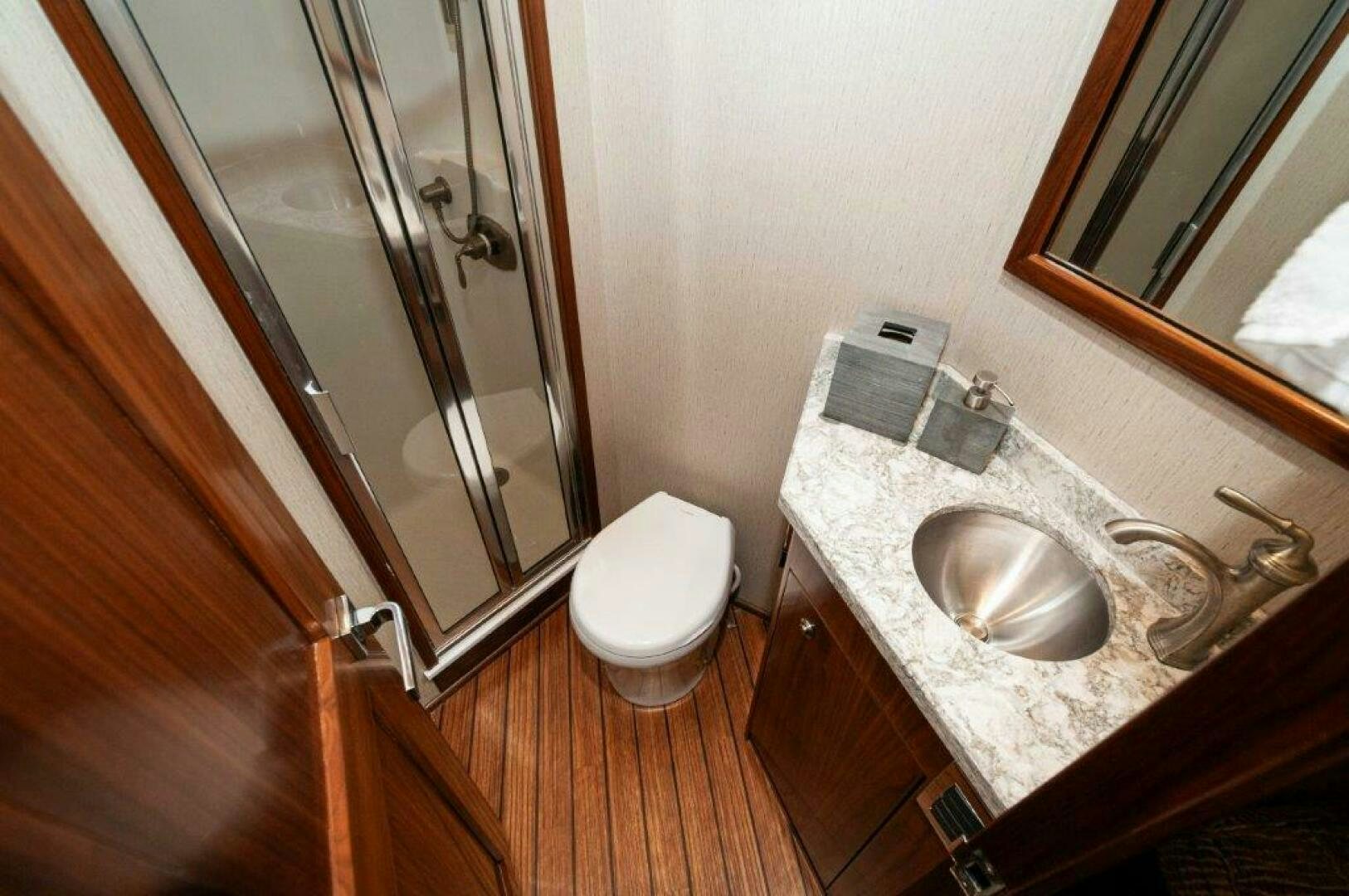 a bathroom with a sink and a toilet aboard GUNNSLINGER Yacht for Sale