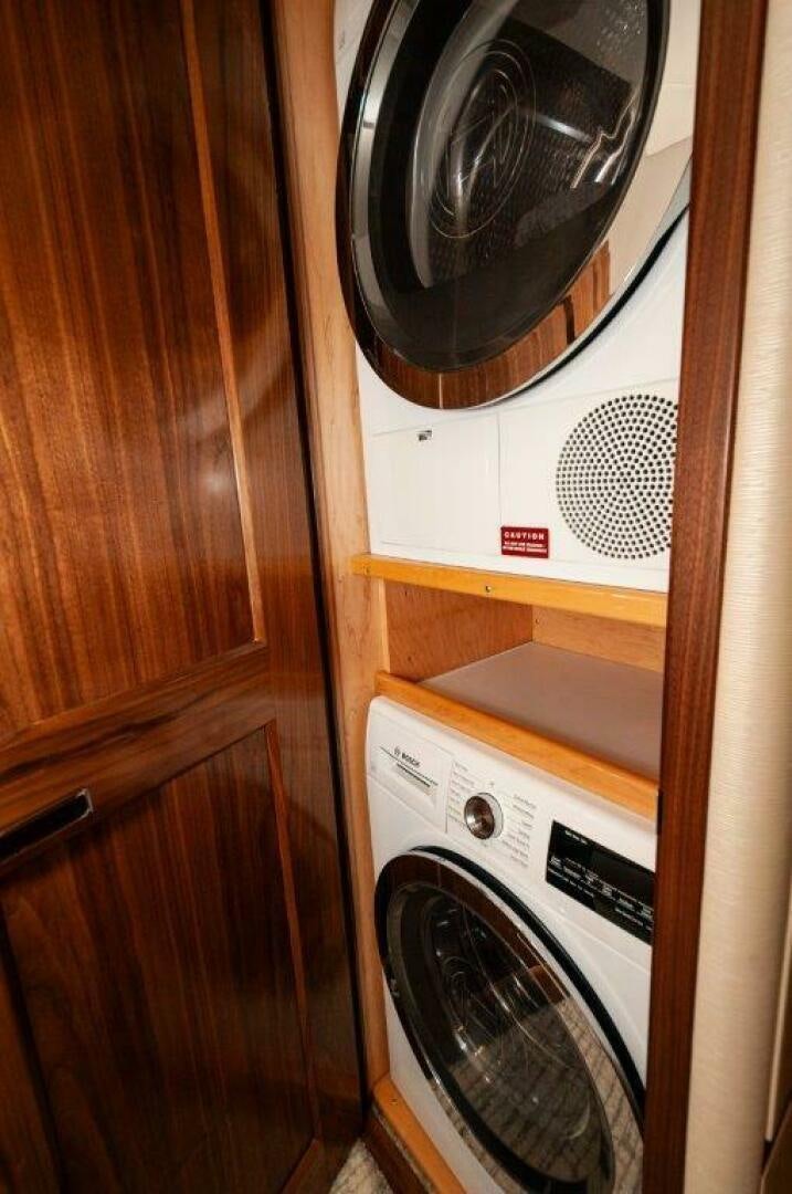 a washer and dryer in a closet aboard GUNNSLINGER Yacht for Sale