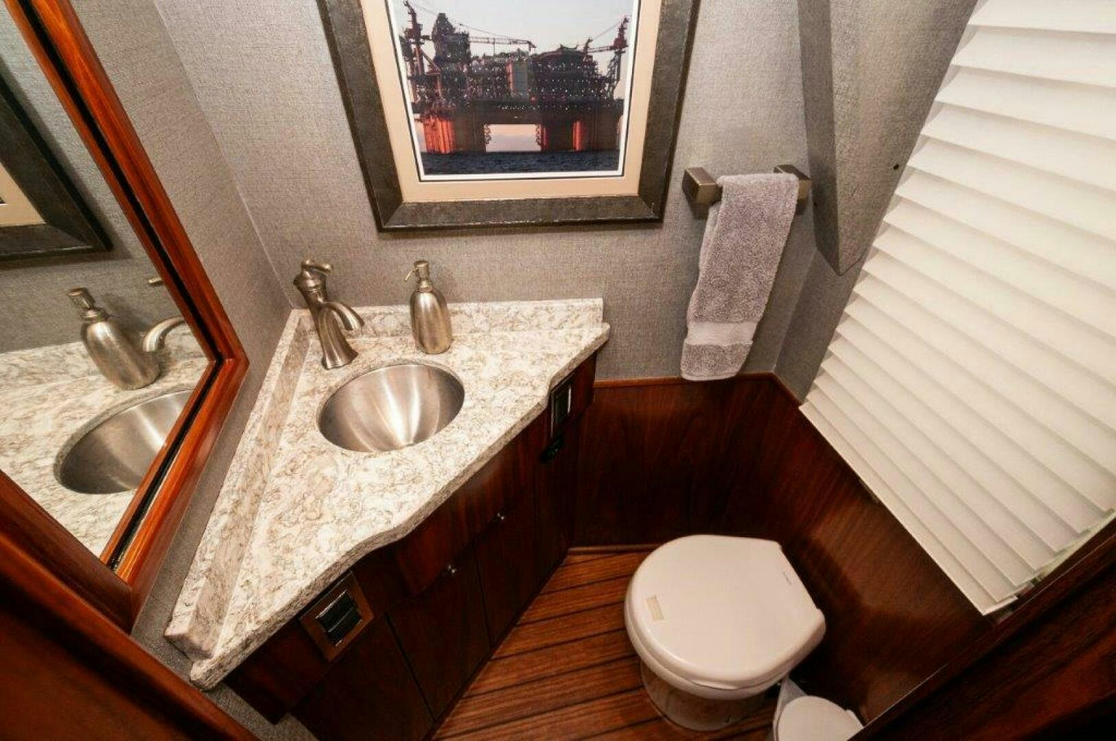 a bathroom with a sink and a toilet aboard GUNNSLINGER Yacht for Sale