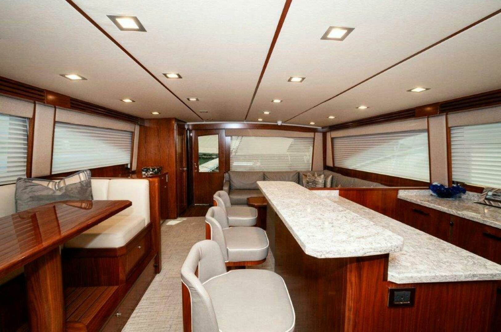 a room with a table and chairs aboard GUNNSLINGER Yacht for Sale