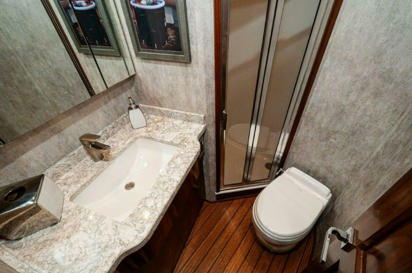 a bathroom with a sink and a toilet aboard GUNNSLINGER Yacht for Sale