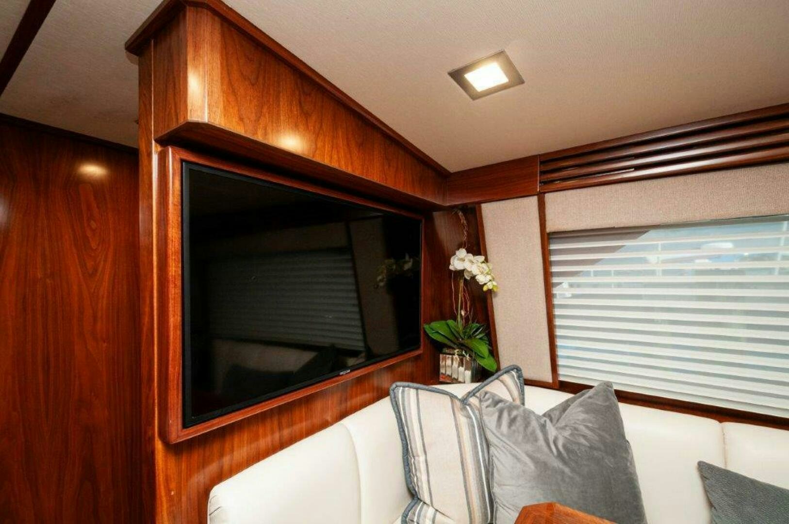a room with a television and a couch aboard GUNNSLINGER Yacht for Sale