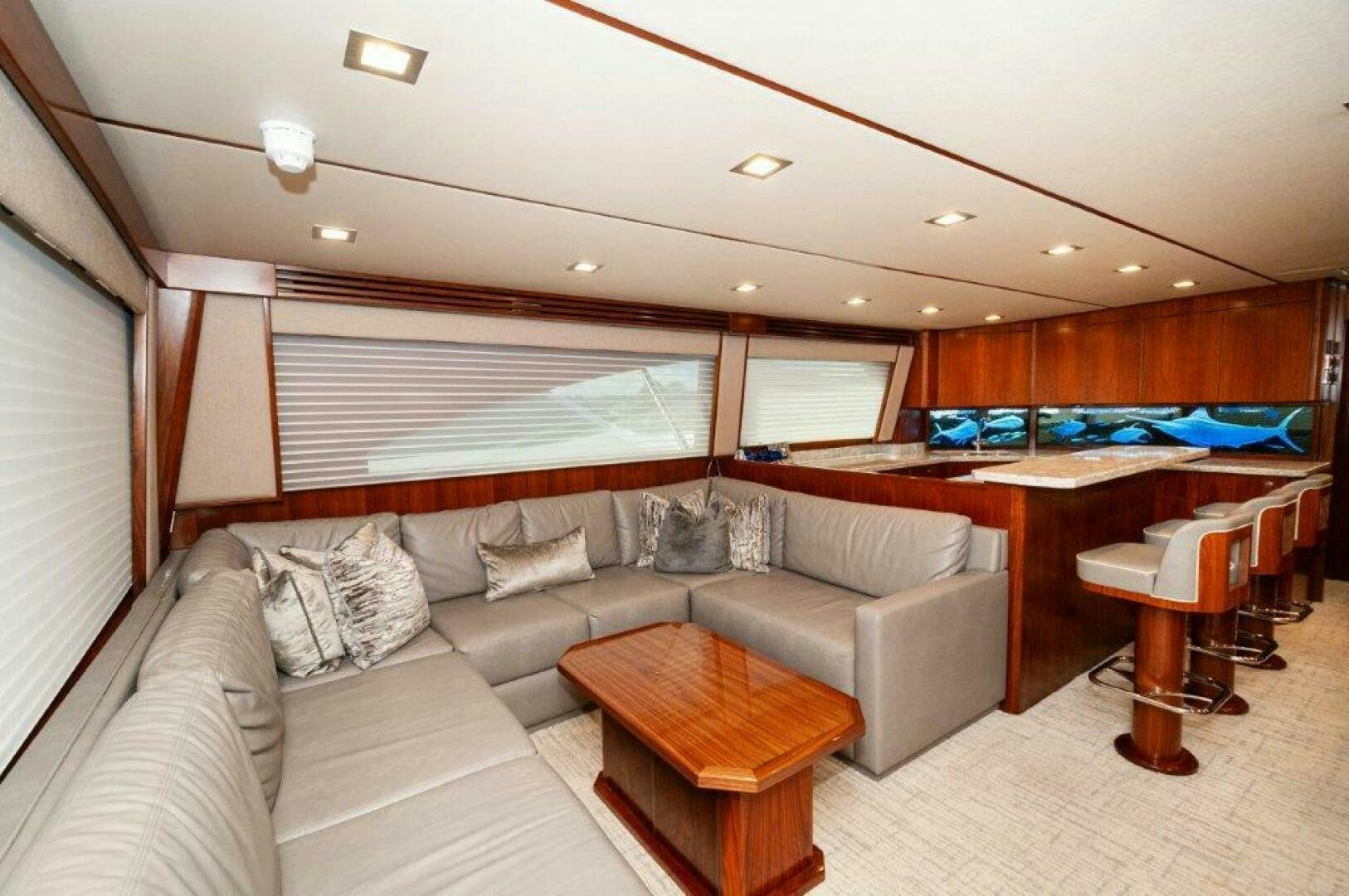 a living room with a couch and a table aboard GUNNSLINGER Yacht for Sale
