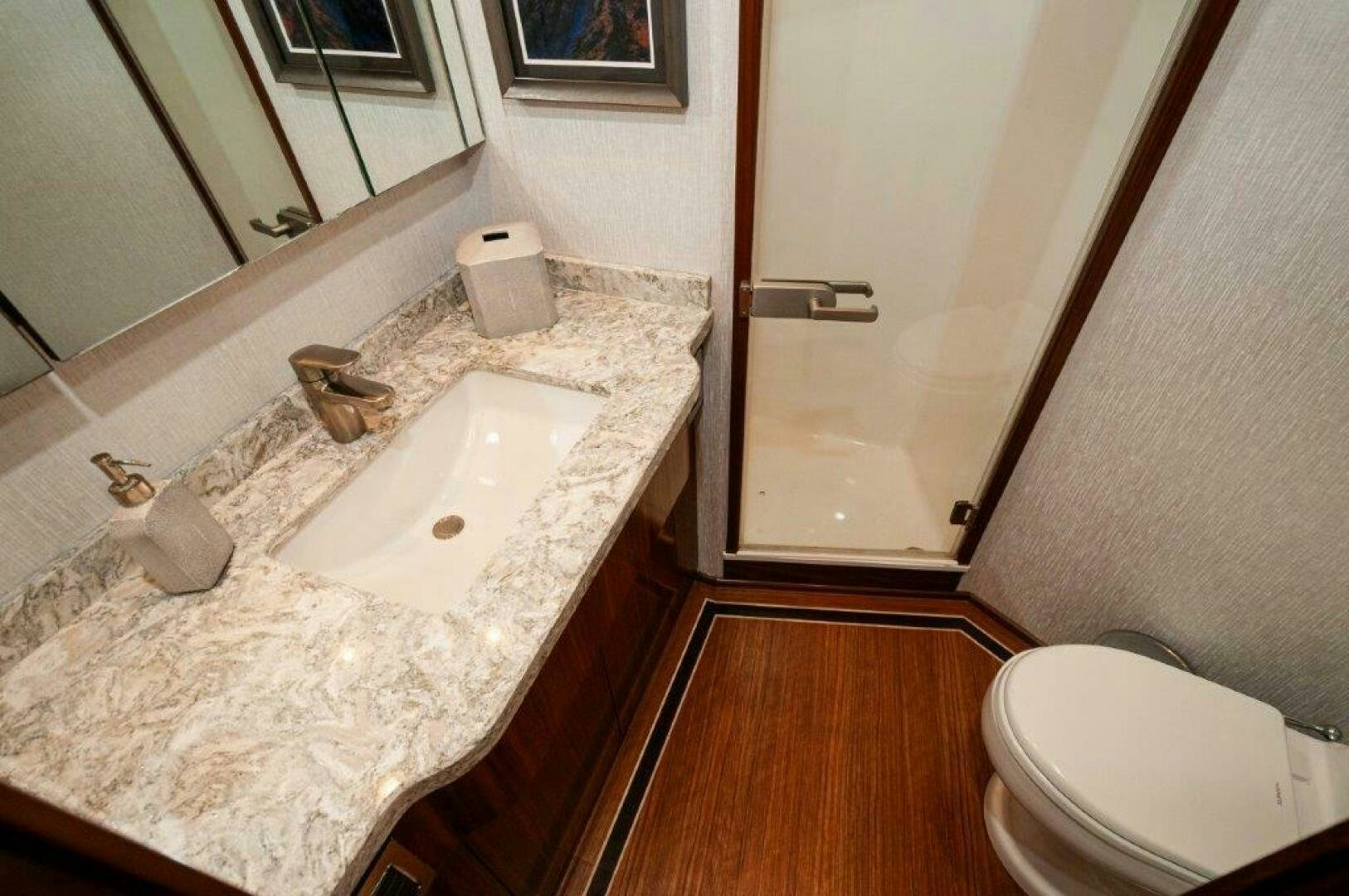 a bathroom with a sink and toilet aboard GUNNSLINGER Yacht for Sale