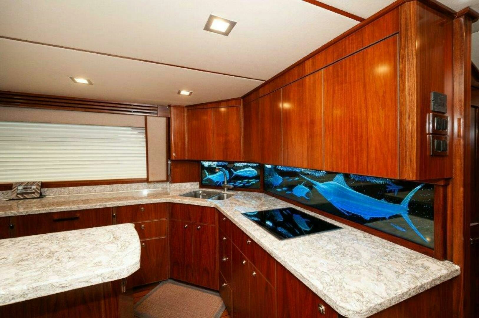a kitchen with a large island aboard GUNNSLINGER Yacht for Sale