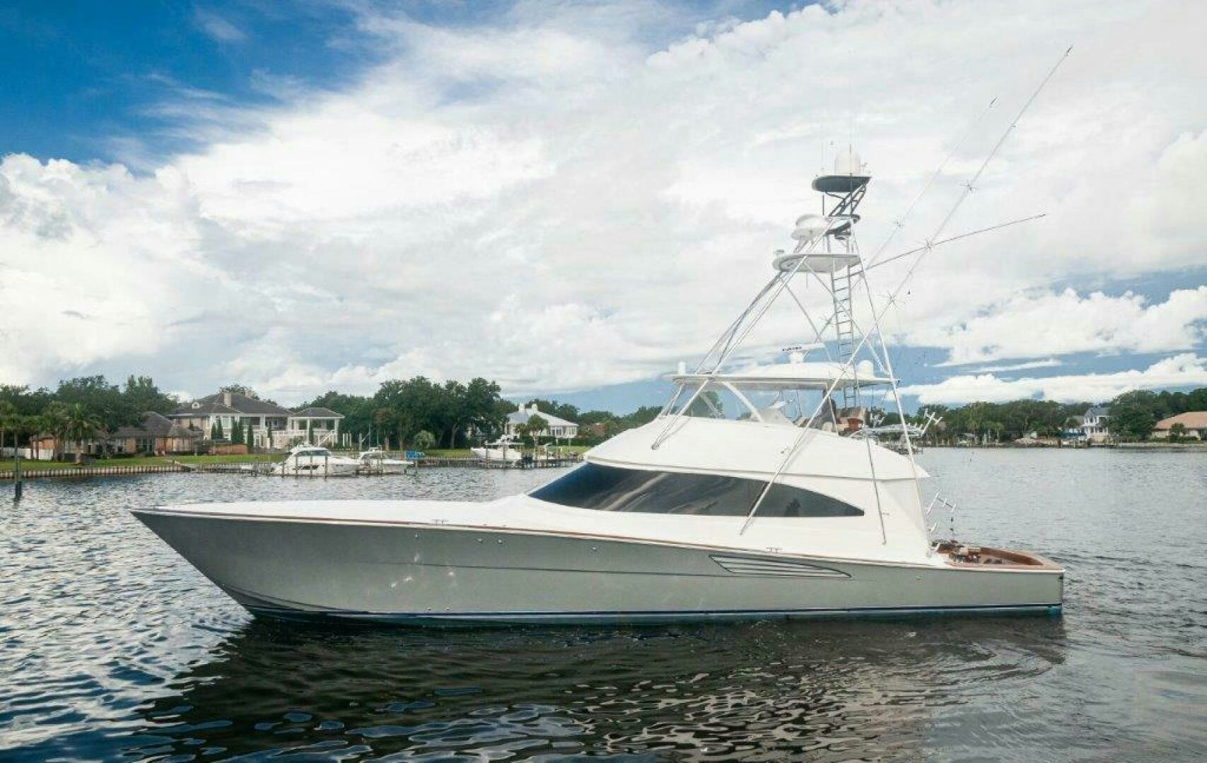 a white boat on the water aboard GUNNSLINGER Yacht for Sale