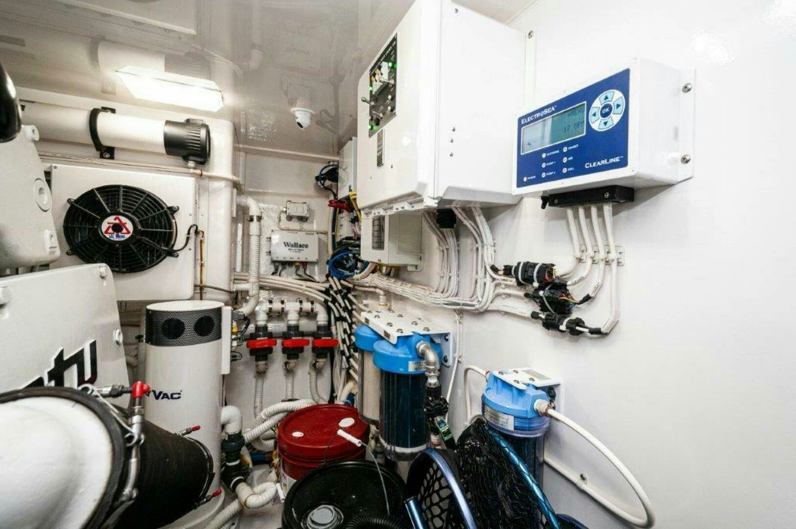 a white room with a machine aboard GUNNSLINGER Yacht for Sale