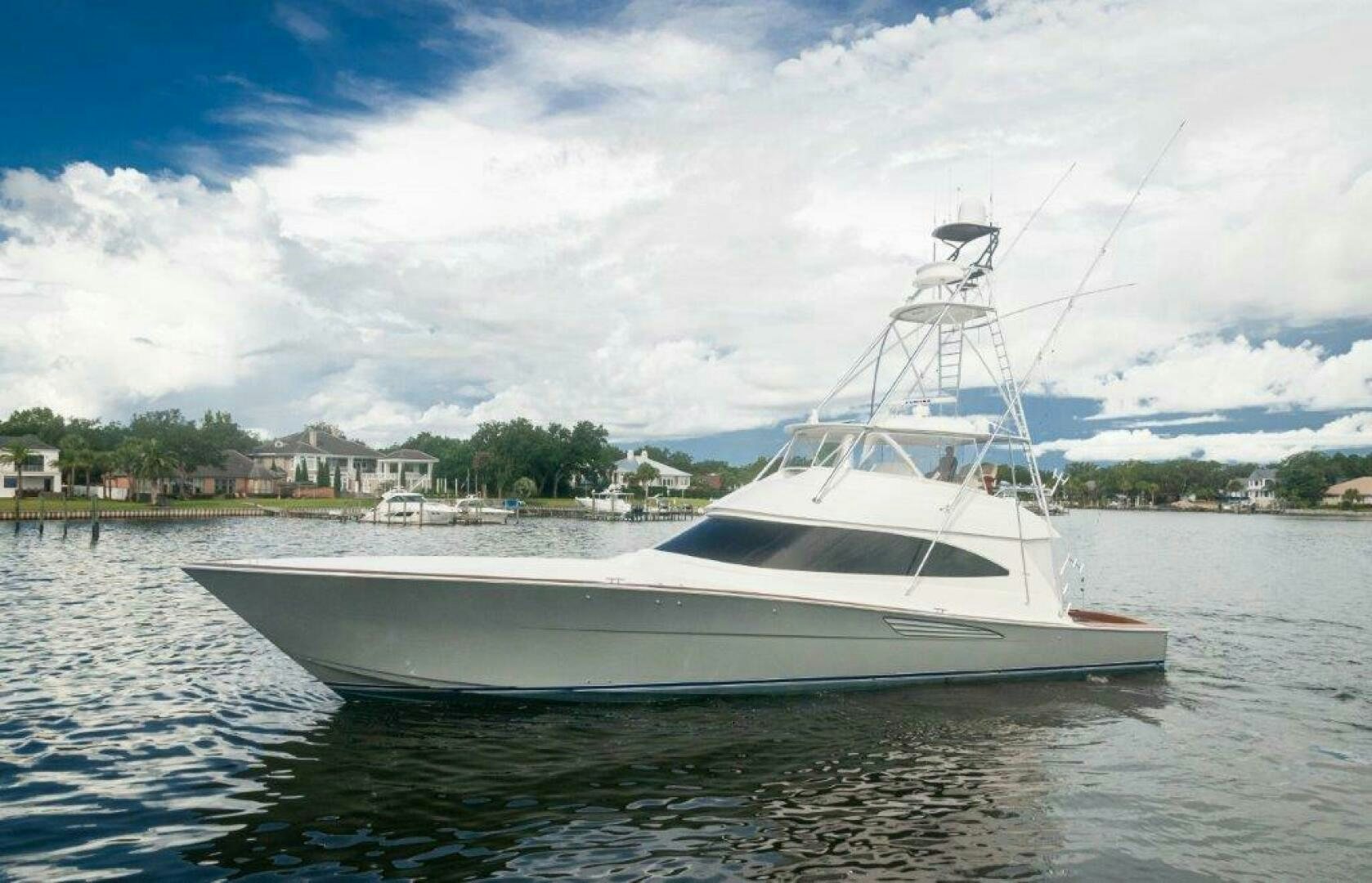 a white boat on the water aboard GUNNSLINGER Yacht for Sale