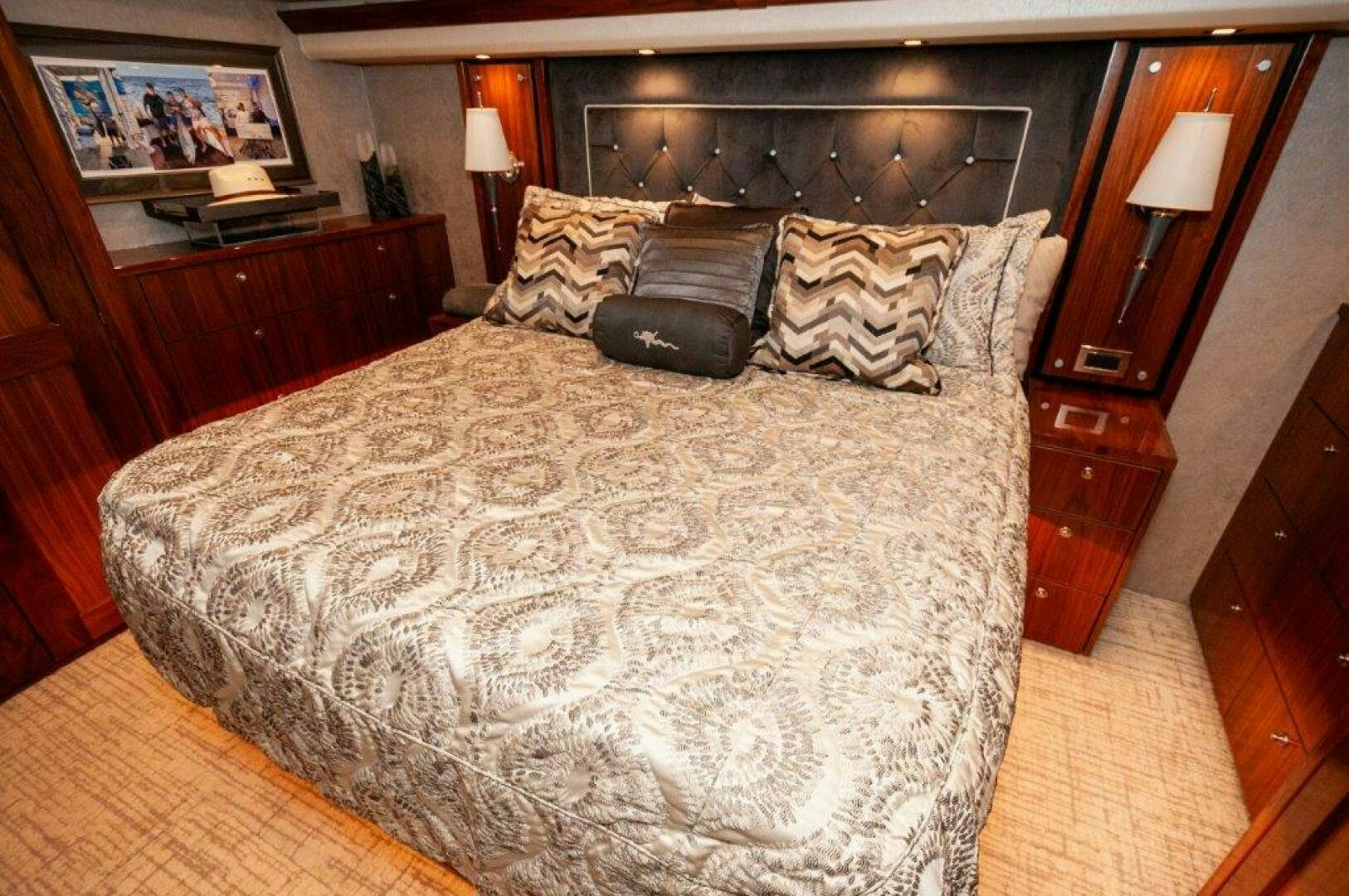 a bed with a white comforter aboard GUNNSLINGER Yacht for Sale