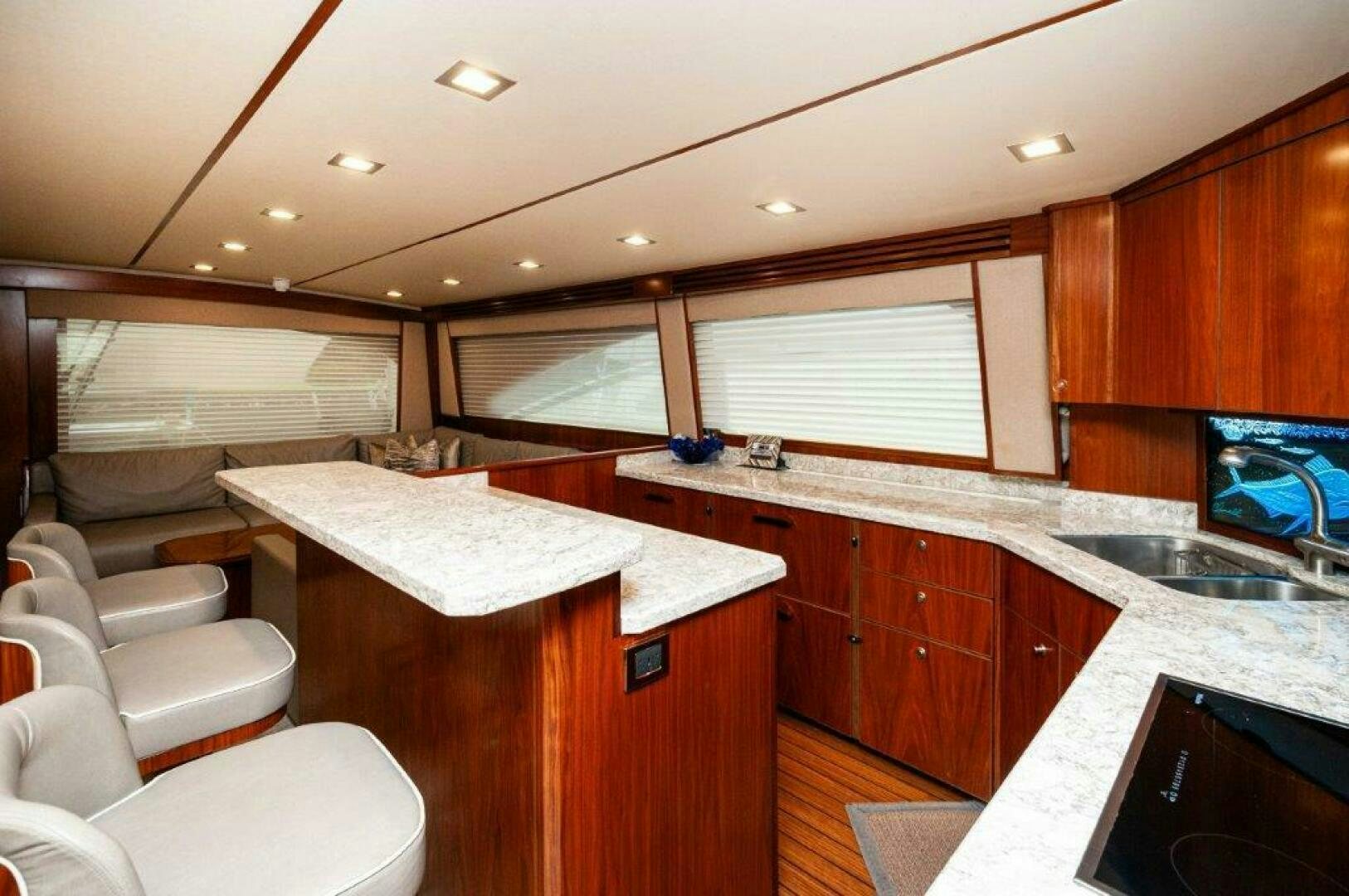 a kitchen with a large island aboard GUNNSLINGER Yacht for Sale