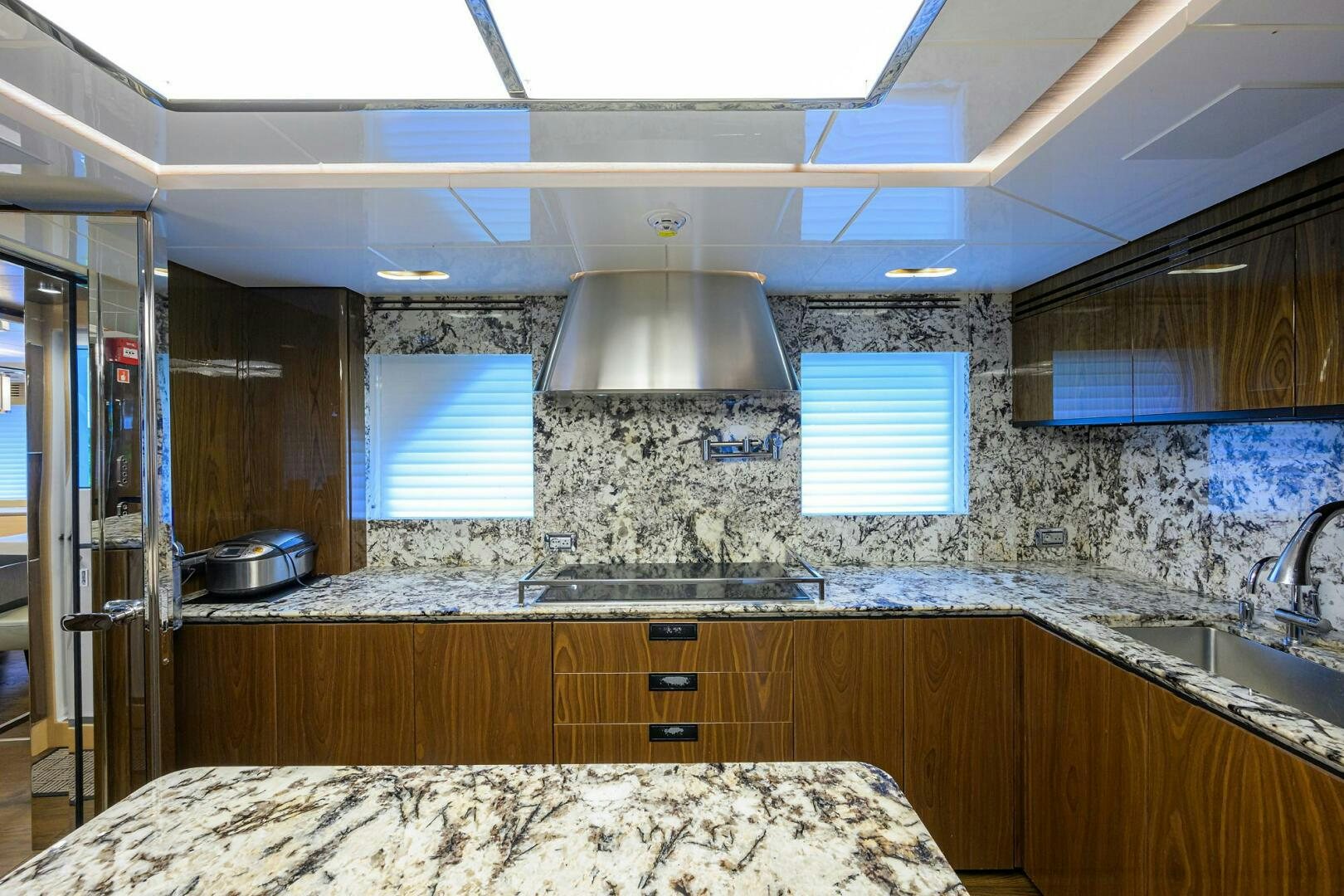 a kitchen with a tile wall aboard UPTIGHT Yacht for Sale