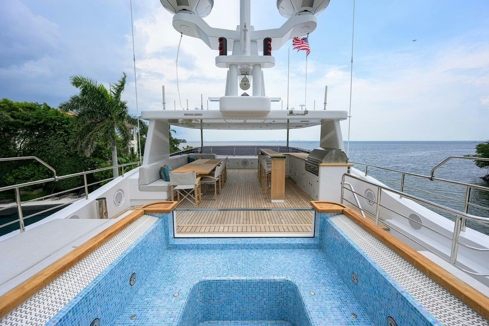 a pool with a pool and a white tower by the water aboard UPTIGHT Yacht for Sale