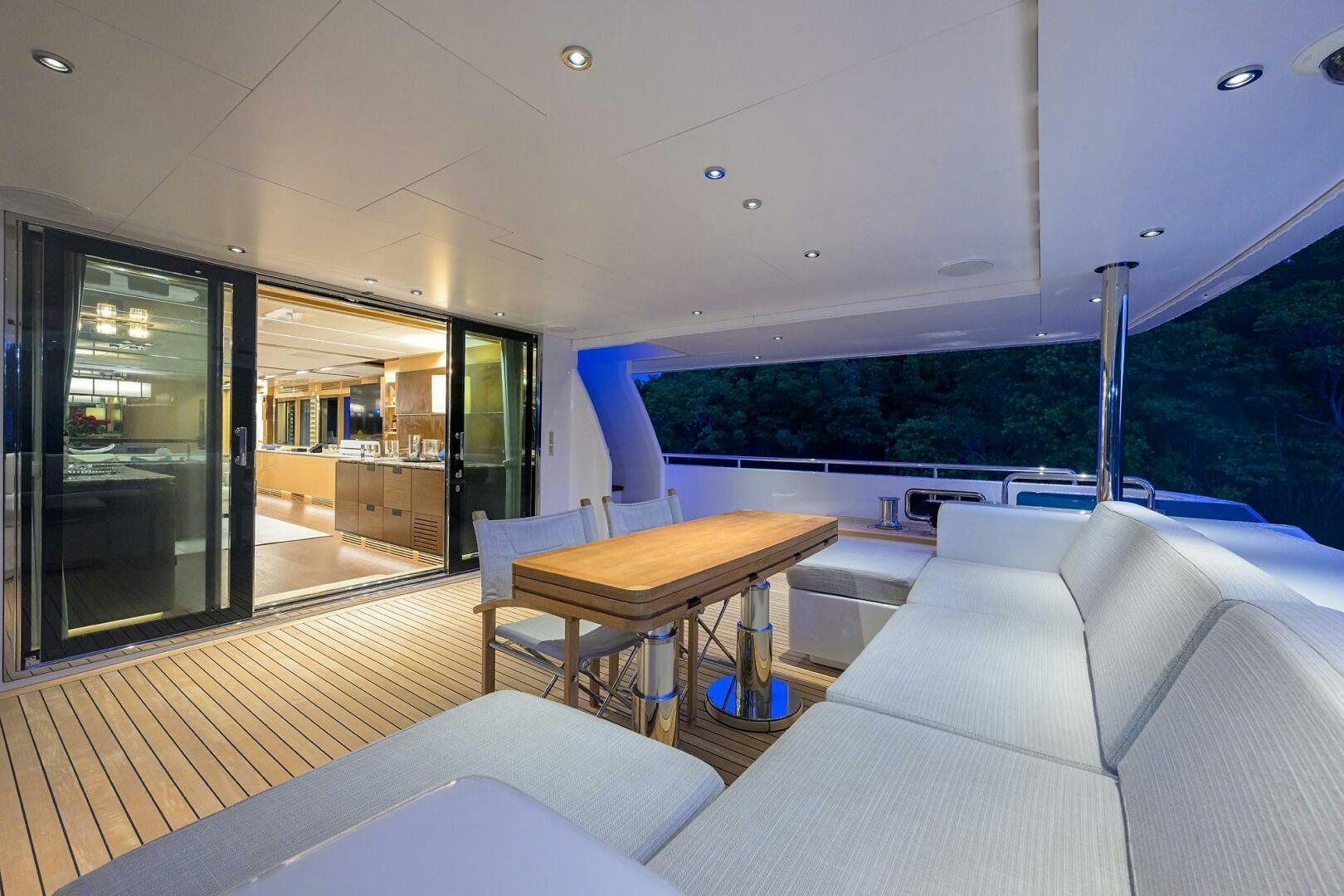 a living room with a large screen aboard UPTIGHT Yacht for Sale