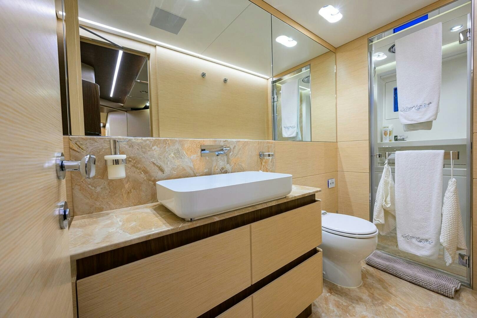 a bathroom with a sink and toilet aboard UPTIGHT Yacht for Sale