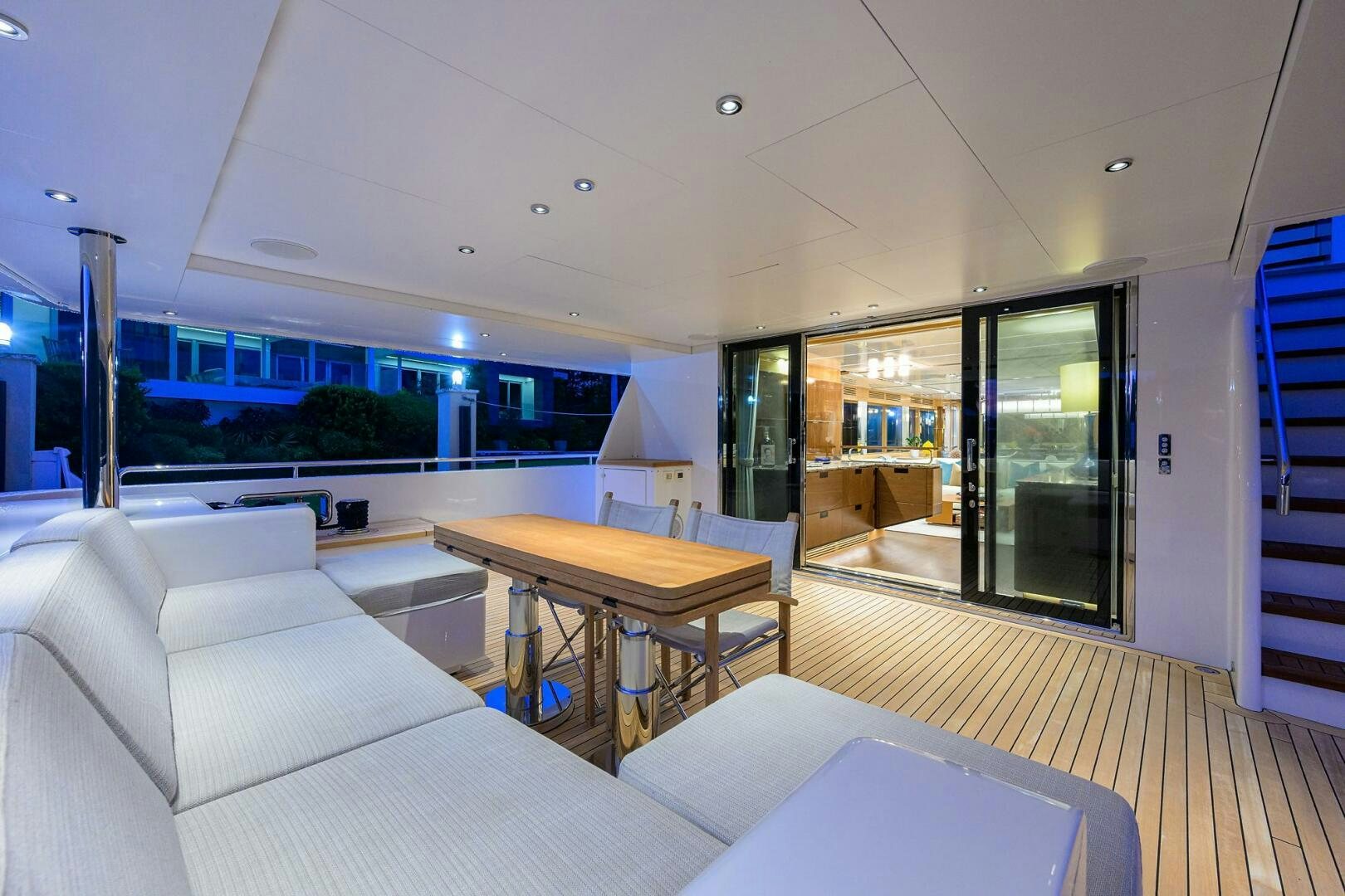 a living room with a table and couches aboard UPTIGHT Yacht for Sale