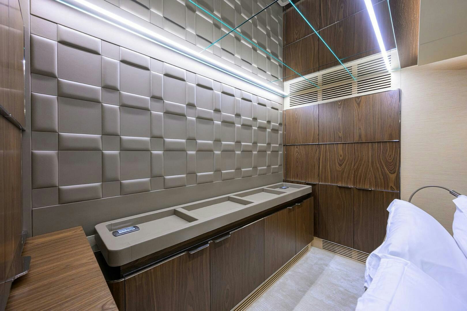 a room with a bed and a desk aboard UPTIGHT Yacht for Sale