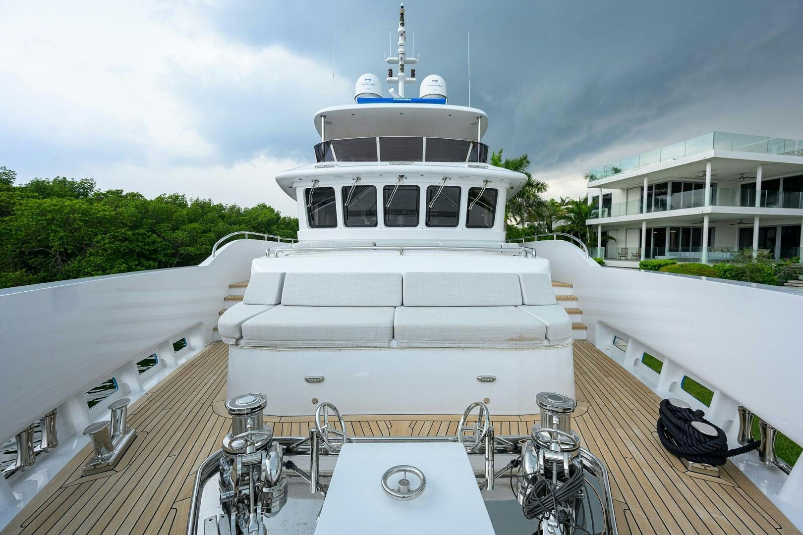 a white boat on a deck aboard UPTIGHT Yacht for Sale