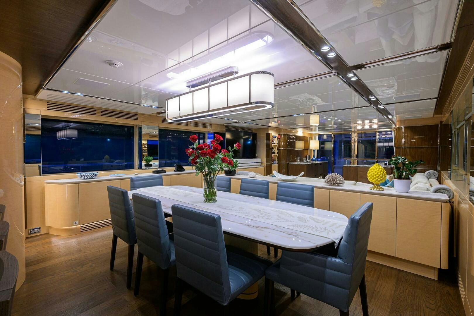 a room with a table chairs and a large window aboard UPTIGHT Yacht for Sale