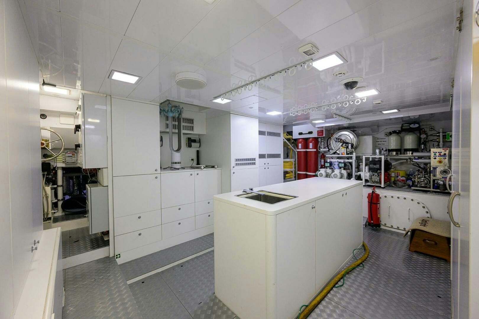 a room with white cabinets and a white counter aboard UPTIGHT Yacht for Sale