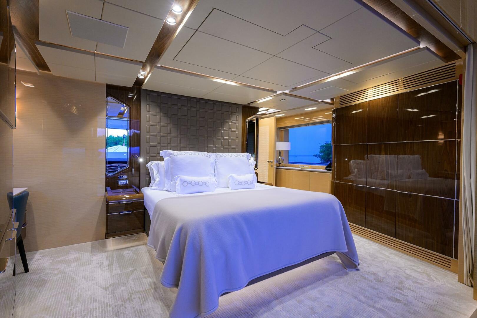a room with a bed and a tv aboard UPTIGHT Yacht for Sale