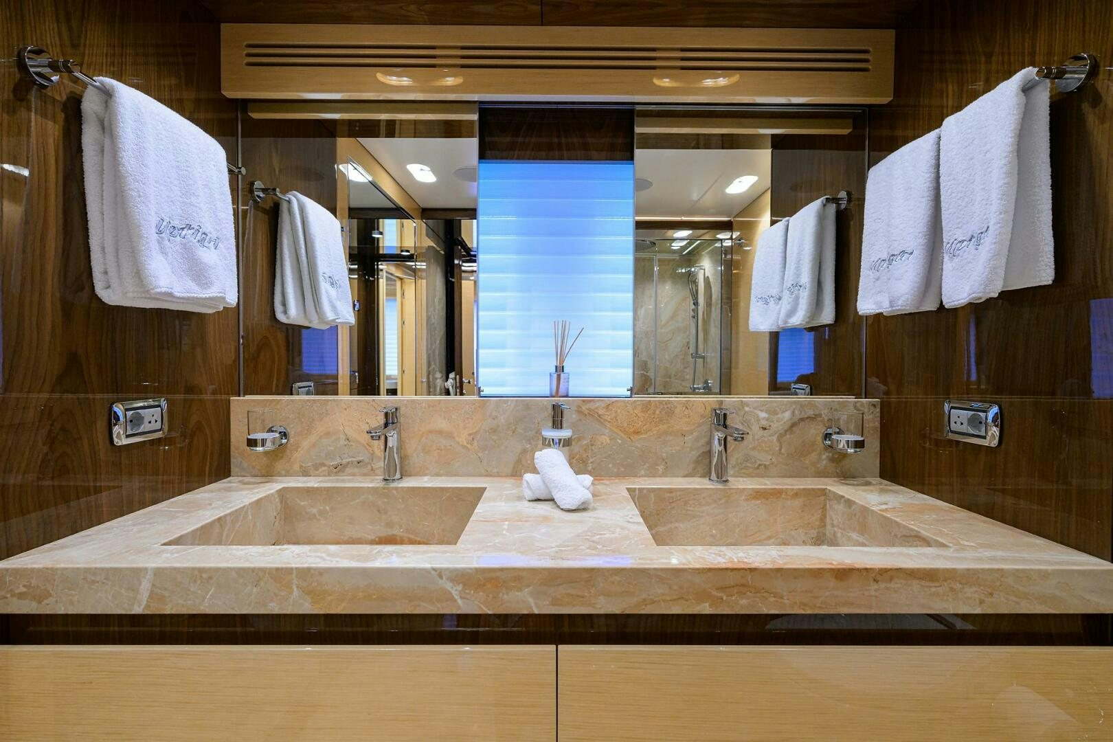 a bathroom with a large mirror aboard UPTIGHT Yacht for Sale