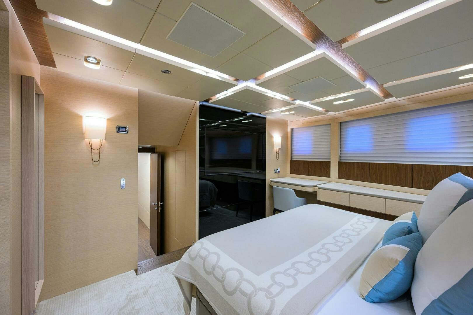 a room with beds and a window aboard UPTIGHT Yacht for Sale