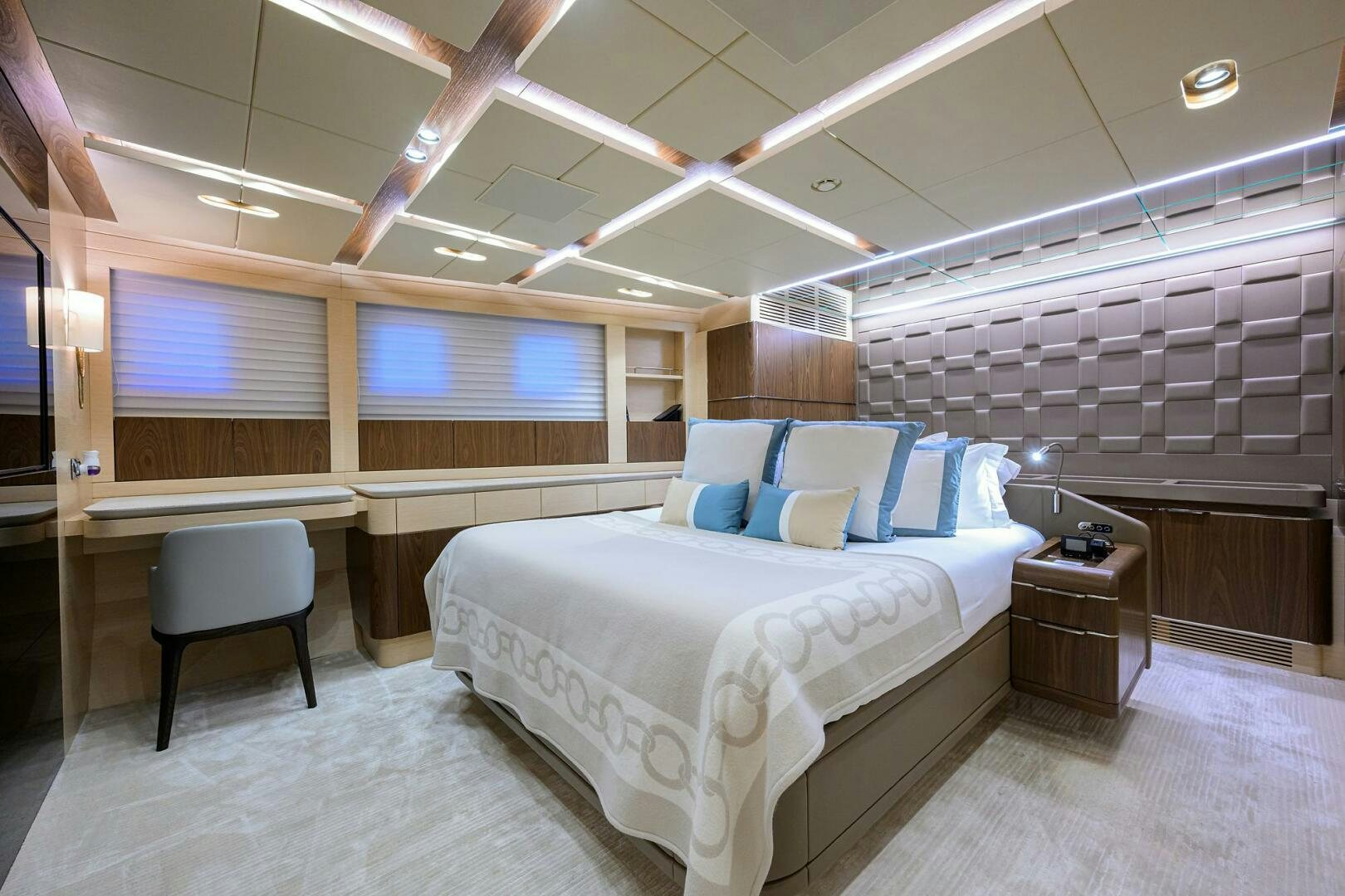 a room with a bed and a desk aboard UPTIGHT Yacht for Sale