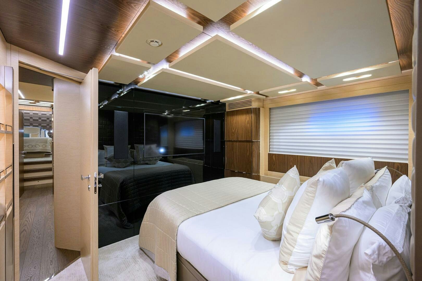 a room with a bed and a couch aboard UPTIGHT Yacht for Sale