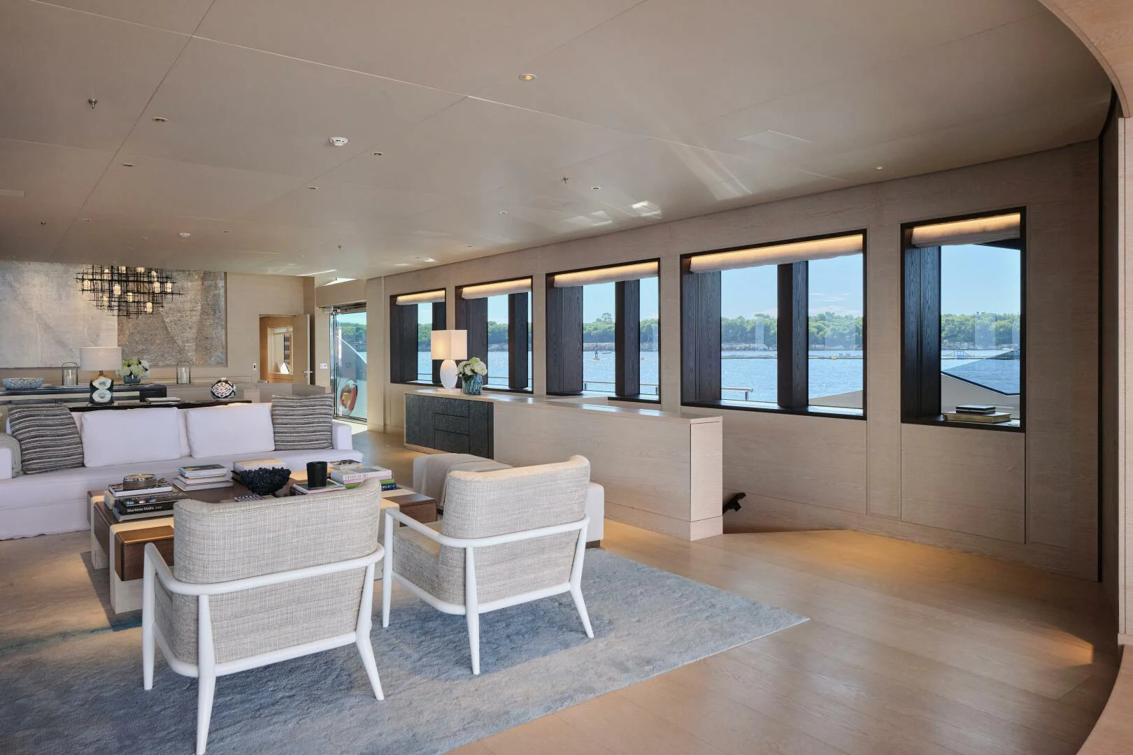 a room with a large window and a table and chairs aboard SANAM Yacht for Sale
