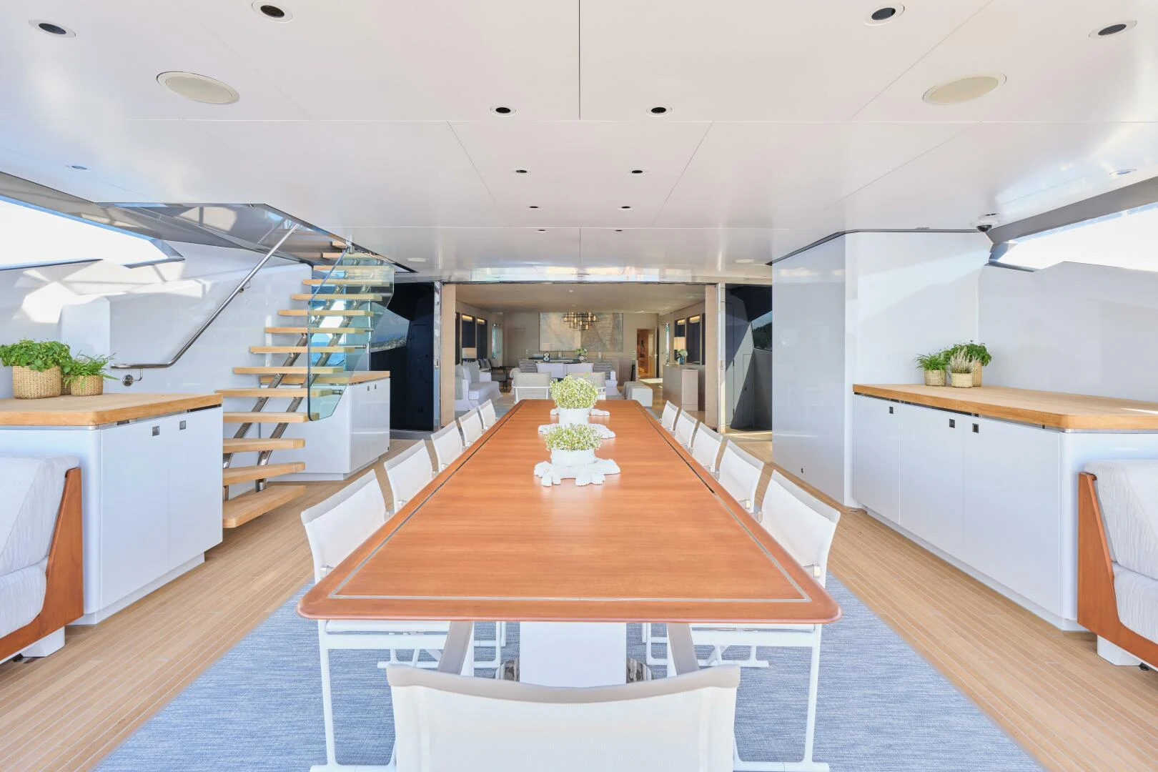 a large kitchen with a table aboard SANAM Yacht for Sale