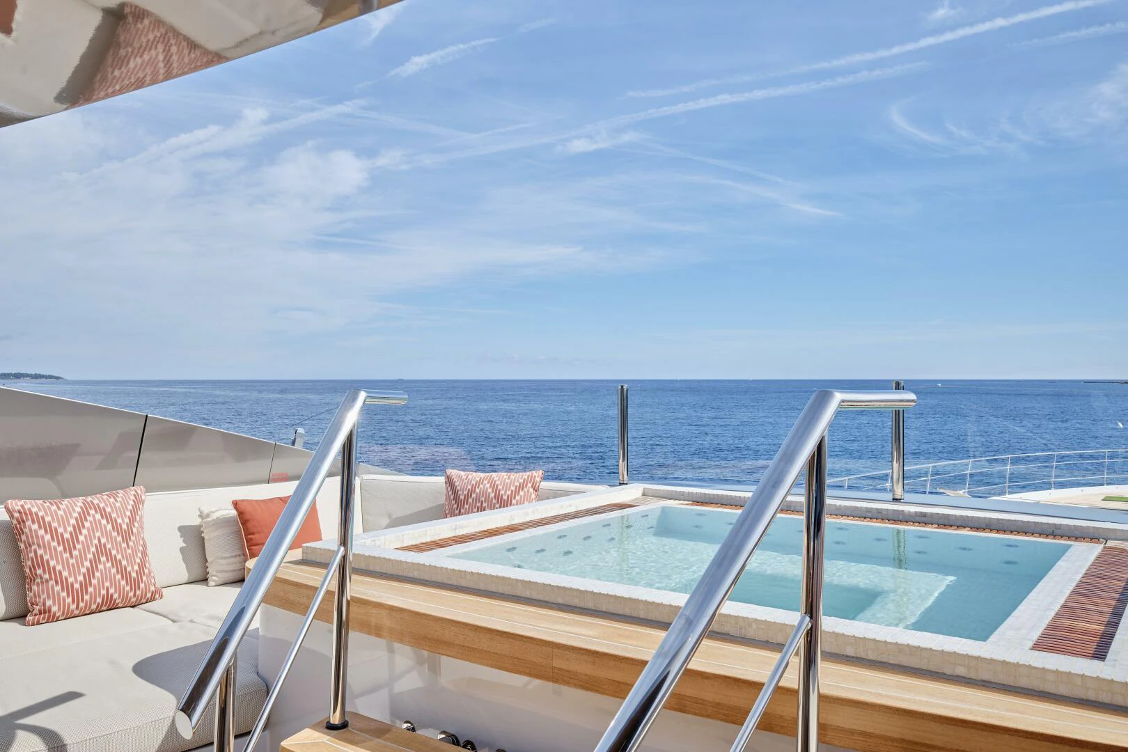 a deck with a view of the ocean and the ocean aboard SANAM Yacht for Sale
