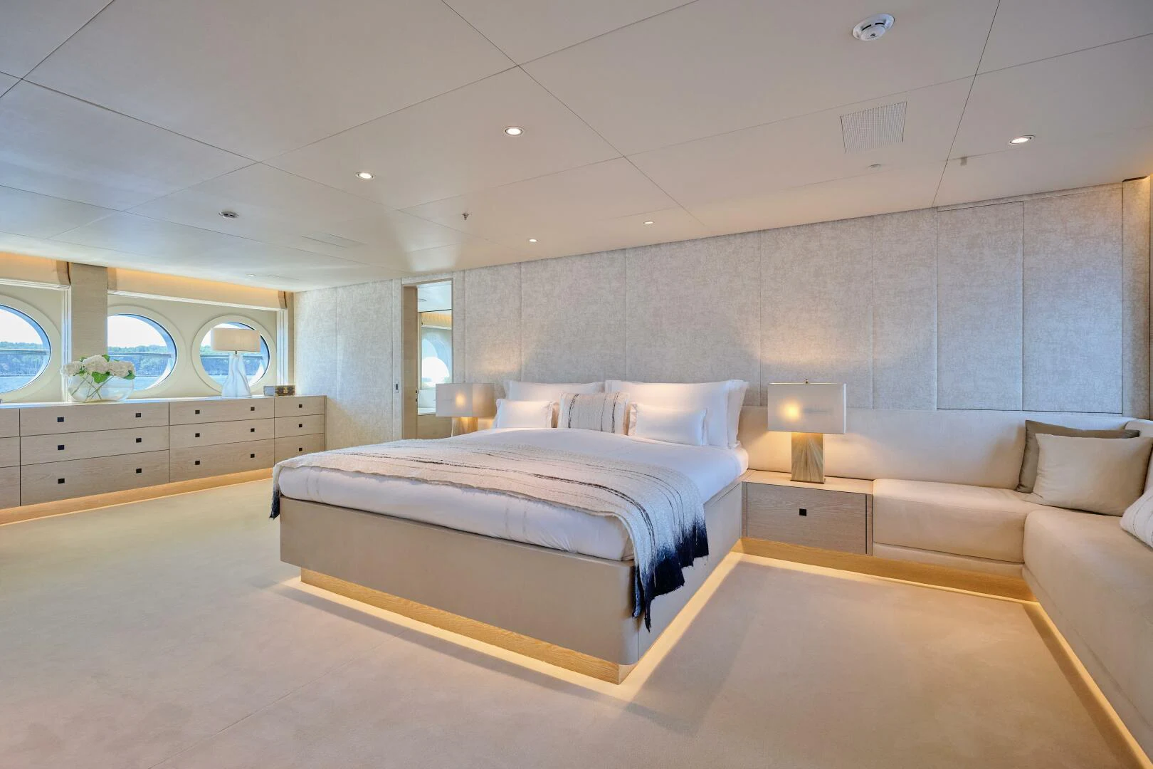 a bedroom with a bed and a couch aboard SANAM Yacht for Sale