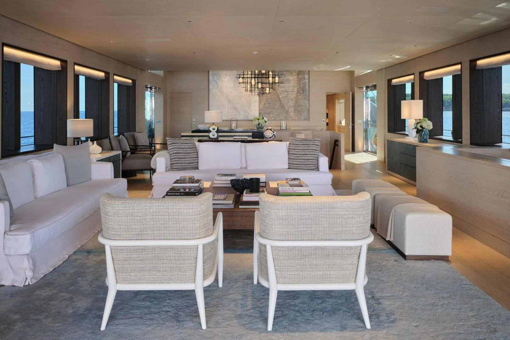 a living room with white furniture aboard SANAM Yacht for Sale