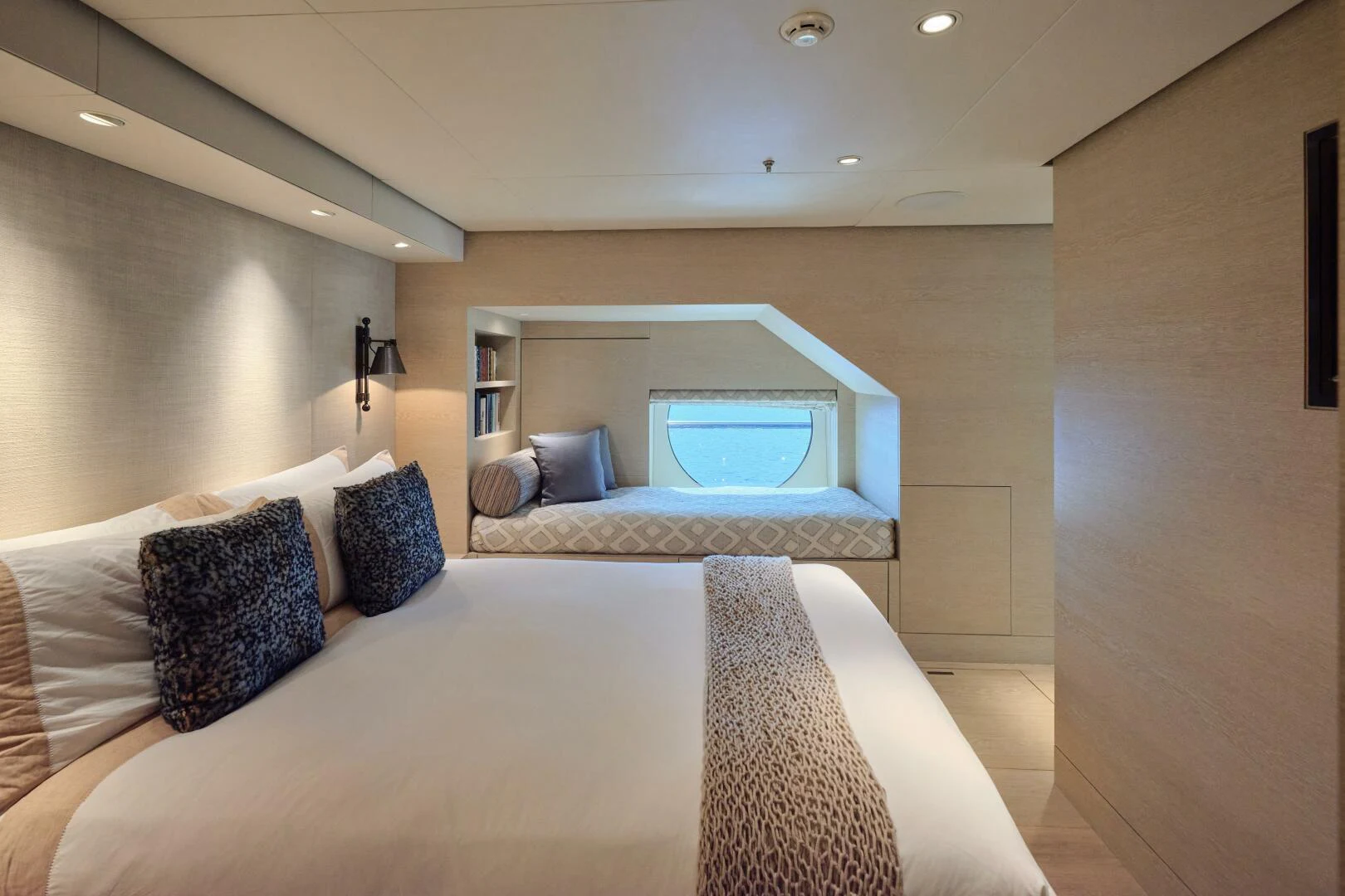 a bed with pillows and a mirror aboard SANAM Yacht for Sale