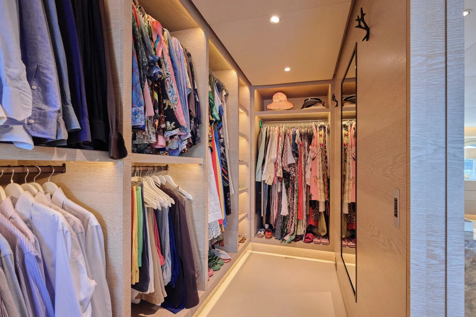 a closet full of clothes aboard SANAM Yacht for Sale