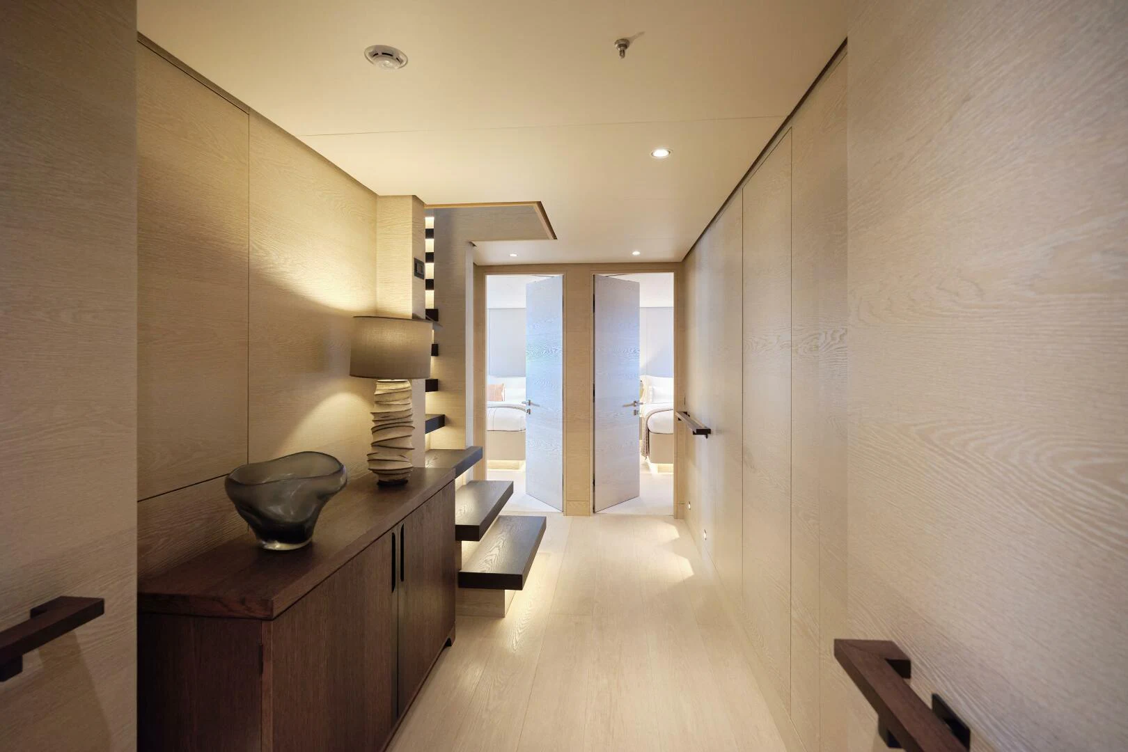 a hallway with a wood floor and a bowl on the table aboard SANAM Yacht for Sale