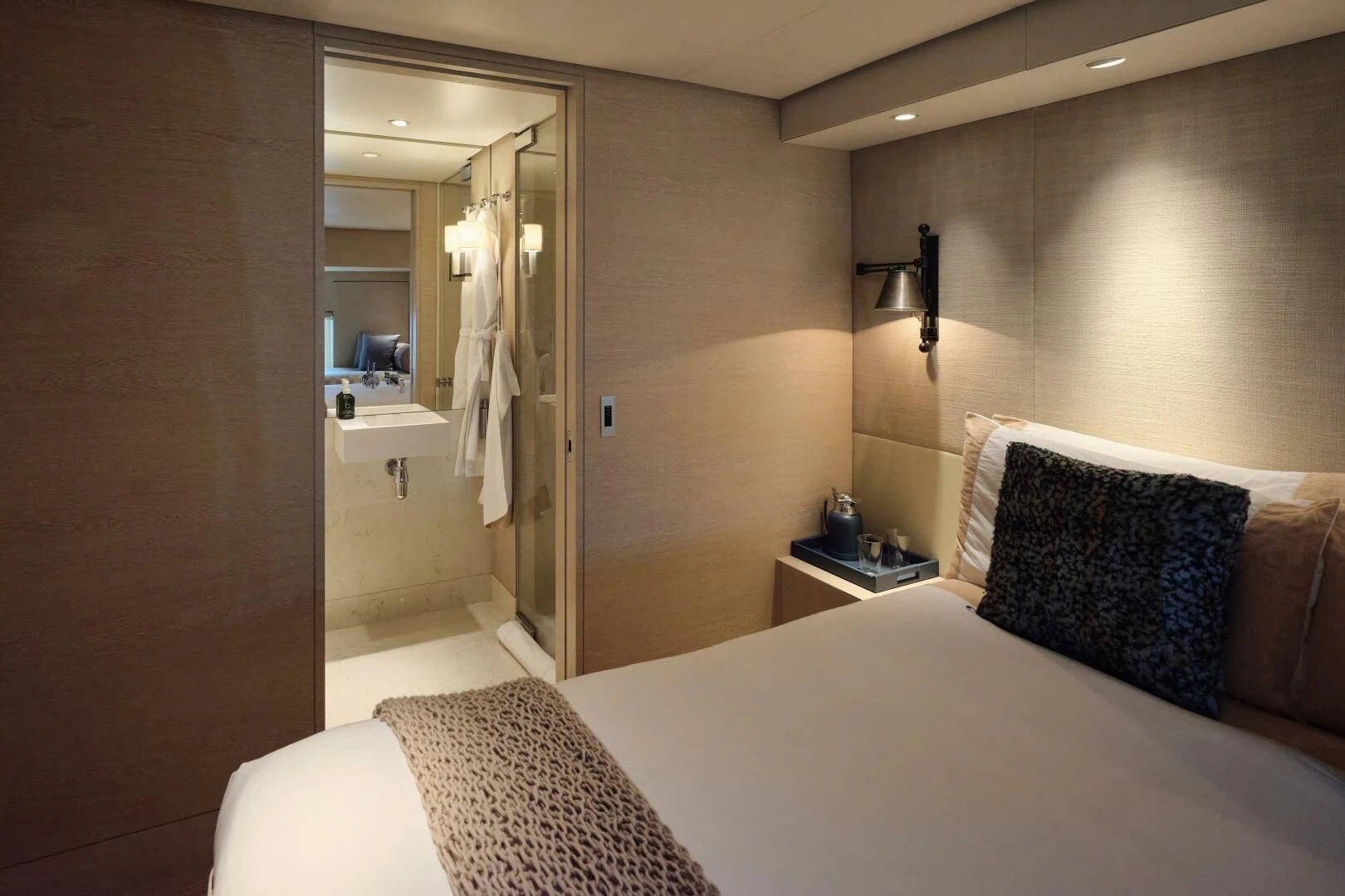 a hotel room with a bed and mirror aboard SANAM Yacht for Sale