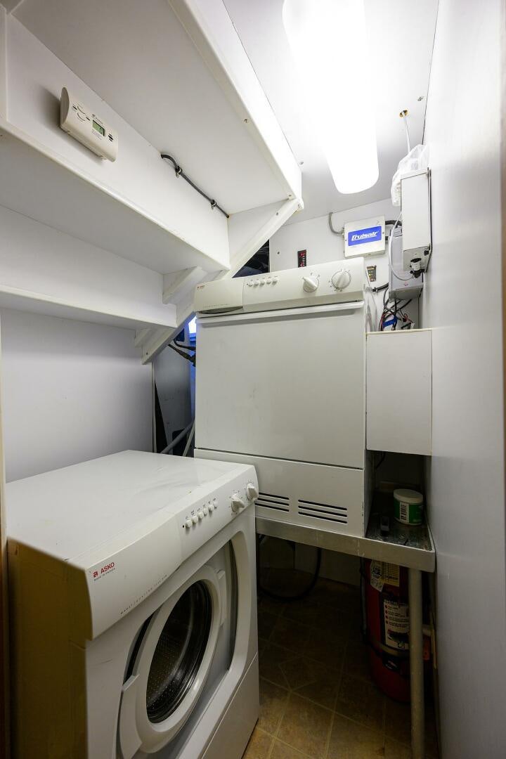 a laundry room with a washing machine aboard BUSINESS TRIP 2 Yacht for Sale