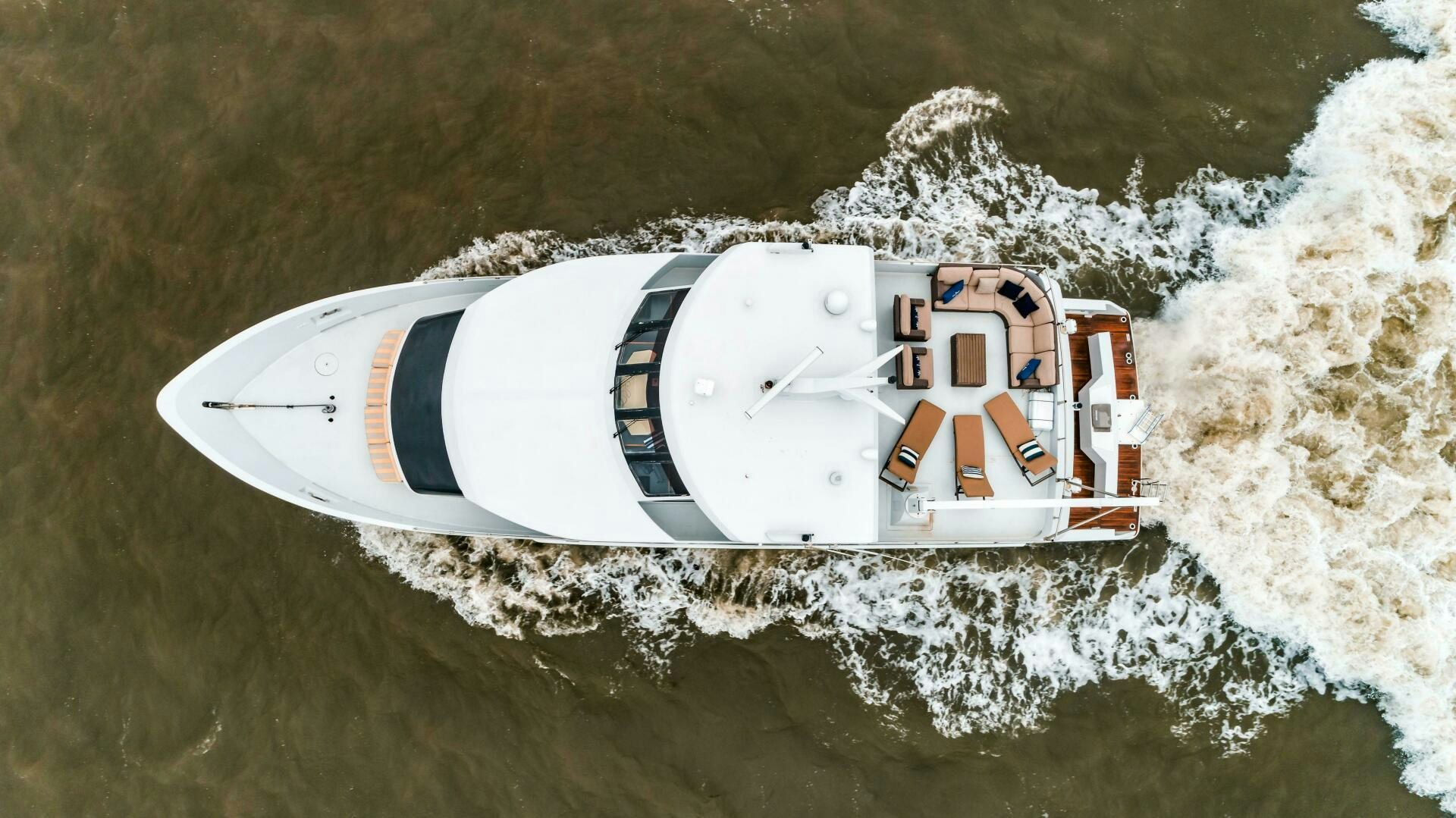 a white and red boat in the water aboard BUSINESS TRIP 2 Yacht for Sale