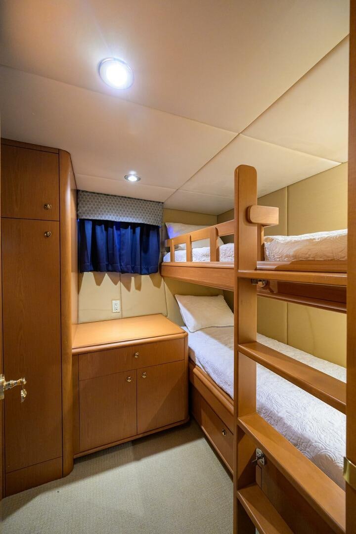 bunk beds in a room aboard BUSINESS TRIP 2 Yacht for Sale