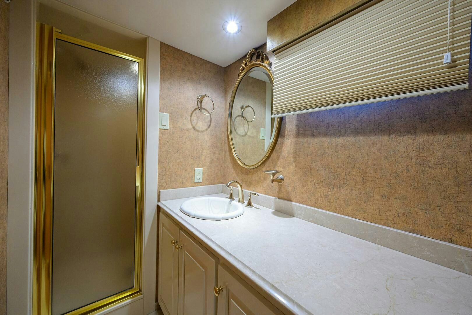 a bathroom with a large mirror aboard BUSINESS TRIP 2 Yacht for Sale