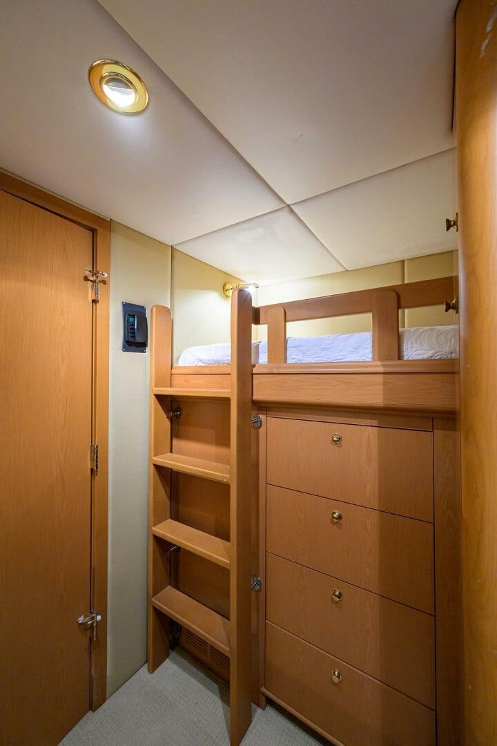 a wooden bunk bed aboard BUSINESS TRIP 2 Yacht for Sale