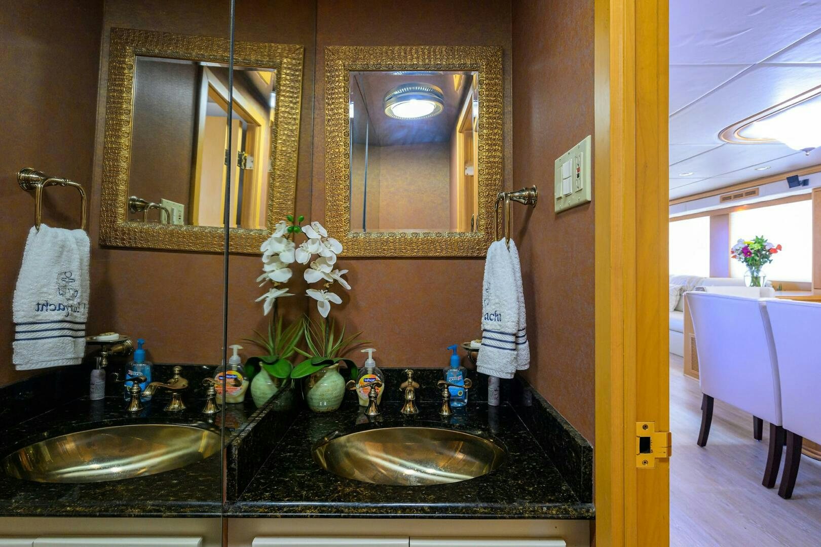 a bathroom with a sink and mirror aboard BUSINESS TRIP 2 Yacht for Sale