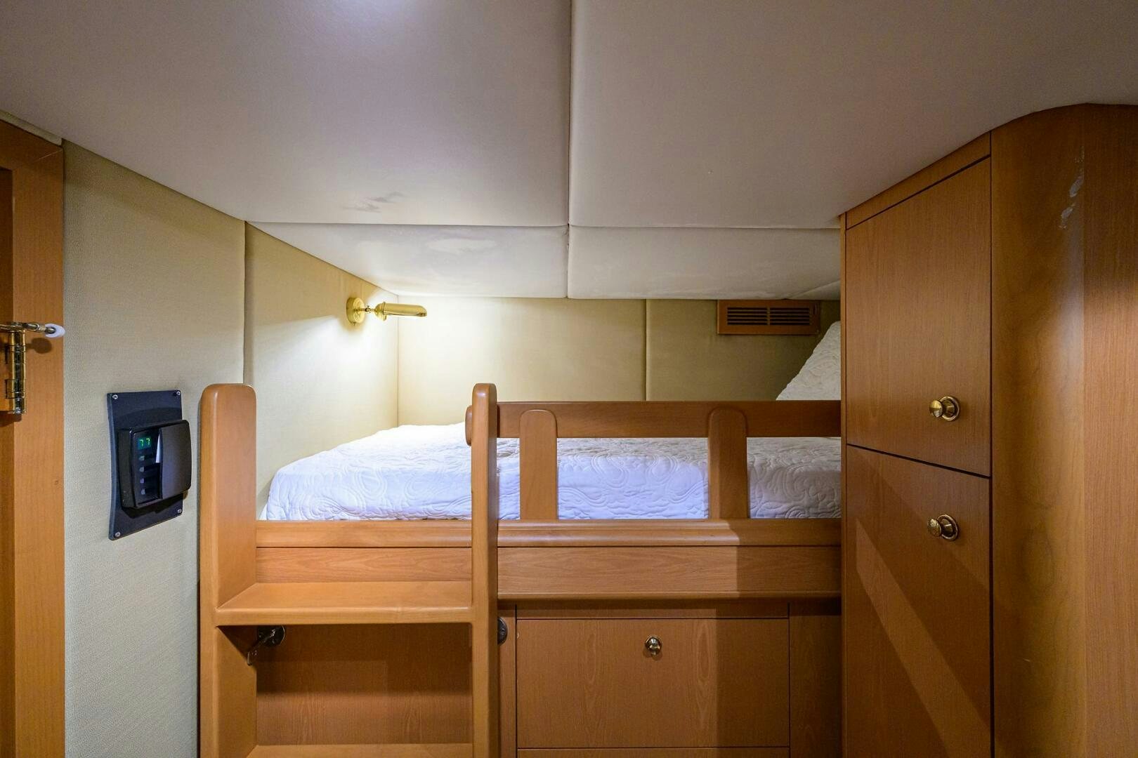 a room with wooden furniture aboard BUSINESS TRIP 2 Yacht for Sale