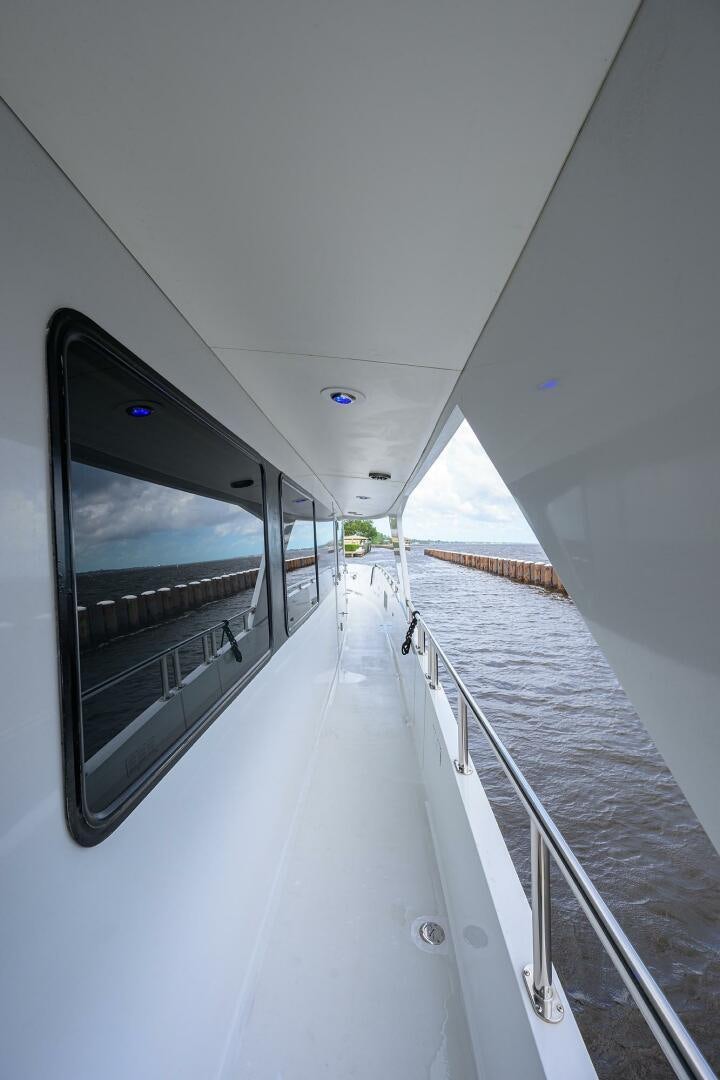 a long hallway with a railing aboard BUSINESS TRIP 2 Yacht for Sale